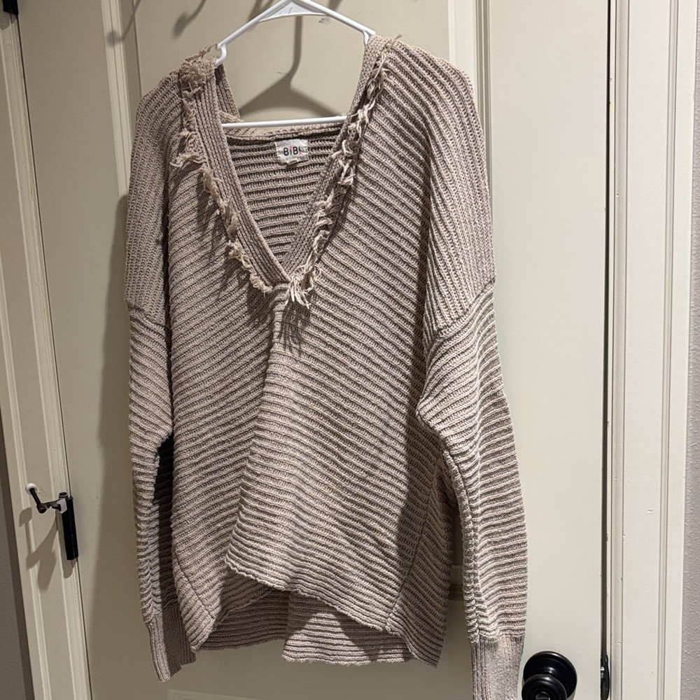 BiBi Ribbed V-Neck Hooded Fringe Top Sweater in Beige/Tan
